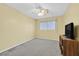 Bedroom with carpet, ceiling fan, window and furniture at 9815 Ramhorn Canyon St, Las Vegas, NV 89183