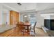 Cozy dining area with wood table, chairs, and access to the backyard at 9815 Ramhorn Canyon St, Las Vegas, NV 89183