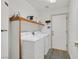 Bright laundry room with white washer and dryer at 9815 Ramhorn Canyon St, Las Vegas, NV 89183