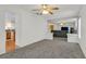 Spacious living room with open floor plan, connecting to kitchen and dining area at 9815 Ramhorn Canyon St, Las Vegas, NV 89183