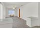 Bright living room with neutral tones, large window, and ceiling fan at 9815 Ramhorn Canyon St, Las Vegas, NV 89183
