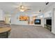 Open living space with fireplace, seamlessly connecting kitchen and dining at 9815 Ramhorn Canyon St, Las Vegas, NV 89183
