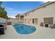 Private backyard featuring a refreshing pool, a relaxing spa, and a convenient barbecue area at 9815 Ramhorn Canyon St, Las Vegas, NV 89183