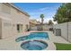 Backyard pool with a hot tub and barbeque at 9815 Ramhorn Canyon St, Las Vegas, NV 89183