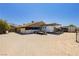 Backyard features a trailer, open space, mature trees, and additional storage sheds at 997 N Christy Ln, Las Vegas, NV 89110