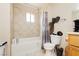 Cozy bathroom featuring tile flooring and a shower-tub combination at 997 N Christy Ln, Las Vegas, NV 89110