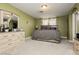 Comfortable bedroom featuring a dresser, mirror, and carpeted floors at 997 N Christy Ln, Las Vegas, NV 89110