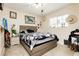 Bedroom featuring tile floor, gray walls, and unique decor on the walls at 997 N Christy Ln, Las Vegas, NV 89110