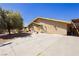 Side view of home with large driveway and double-door entrance at 997 N Christy Ln, Las Vegas, NV 89110
