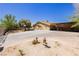 Spacious property featuring a long driveway, covered parking, and mature trees at 997 N Christy Ln, Las Vegas, NV 89110