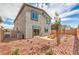 Backyard with stone, seating area, and well-maintained landscape at 1019 Gentle Swan St # 693, Henderson, NV 89011