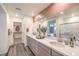 Modern bathroom featuring double sinks, quartz countertops, and a walk-in shower at 1019 Gentle Swan St # 693, Henderson, NV 89011