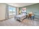 Charming bedroom featuring a cozy bed, desk, and green accent wall at 1019 Gentle Swan St # 693, Henderson, NV 89011