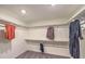 Walk-in closet with ample shelving and clothing on hangers at 1019 Gentle Swan St # 693, Henderson, NV 89011