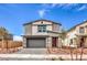 Charming two-story home featuring a modern design, a two-car garage, and drought-resistant landscaping at 1019 Gentle Swan St # 693, Henderson, NV 89011