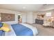 Spacious main bedroom with a walk-in closet, decorative art and a seating area at 1019 Gentle Swan St # 693, Henderson, NV 89011