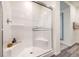 Modern shower with glass enclosure, built-in seat and white subway tile at 1019 Gentle Swan St # 693, Henderson, NV 89011