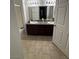Bathroom featuring dual sinks, granite countertop, and shower at 10245 S Maryland Pkwy # 2216, Las Vegas, NV 89183