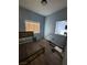 Bedroom with wood floors and view through window into the living room at 10245 S Maryland Pkwy # 2216, Las Vegas, NV 89183