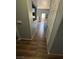 Hallway with wood-look tile flooring and neutral paint at 10245 S Maryland Pkwy # 2216, Las Vegas, NV 89183