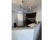 Cozy kitchen featuring stainless steel appliances, dark wood cabinets, and a breakfast bar at 10245 S Maryland Pkwy # 2216, Las Vegas, NV 89183