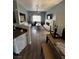 Open-concept living room featuring wood floors, fireplace, Christmas tree, and plenty of natural light at 10245 S Maryland Pkwy # 2216, Las Vegas, NV 89183