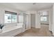 Bright bathroom featuring a tub, shower, and window with natural light at 10508 Waking Cloud Ave, Las Vegas, NV 89129