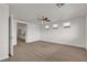 Bright bedroom with a large window, three transom windows, and ceiling fan at 10508 Waking Cloud Ave, Las Vegas, NV 89129