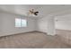 Bright bedroom with a large window, and ceiling fan at 10508 Waking Cloud Ave, Las Vegas, NV 89129