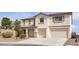 Inviting two-story home with a spacious driveway and a two-car garage at 10508 Waking Cloud Ave, Las Vegas, NV 89129