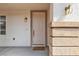 Welcoming front entrance with a stylish door and decorative sconce lighting at 10508 Waking Cloud Ave, Las Vegas, NV 89129