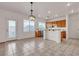 Bright kitchen and dining area features tile flooring and access to the backyard at 10508 Waking Cloud Ave, Las Vegas, NV 89129