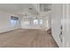 Bright and airy living room featuring an open floor plan and staircase at 10508 Waking Cloud Ave, Las Vegas, NV 89129