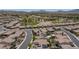 Stunning aerial captures a lush golf course winding through the community, with mountain views at 1105 Strada Pecei, Henderson, NV 89011