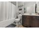 Well-lit bathroom featuring a shower-tub combination, vanity with storage, and modern fixtures at 1105 Strada Pecei, Henderson, NV 89011