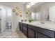 Bathroom with double sinks, nice decor, and neutral gray tiling at 1105 Strada Pecei, Henderson, NV 89011