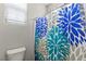 Compact bathroom featuring a toilet and decorative shower curtain at 1105 Strada Pecei, Henderson, NV 89011