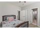 Bedroom with carpet flooring, ceiling fan and attached bathroom at 1105 Strada Pecei, Henderson, NV 89011