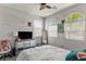 Cozy bedroom features natural light, mirrored dresser, and neutral décor for a peaceful retreat at 1105 Strada Pecei, Henderson, NV 89011