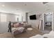 Comfortable bedroom features a cozy lounge area and large windows for ample natural light at 1105 Strada Pecei, Henderson, NV 89011