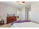 Comfortable bedroom featuring a ceiling fan, carpet flooring, and attached bath at 1105 Strada Pecei, Henderson, NV 89011