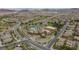 Aerial showcases a resort-style community pool, a clubhouse and meticulously landscaped grounds at 1105 Strada Pecei, Henderson, NV 89011
