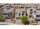 Charming home boasts a tile roof, balcony, and landscaped front yard in a desirable neighborhood at 1105 Strada Pecei, Henderson, NV 89011