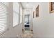 Hallway with tile floors that leads into a naturally lit bedroom at 1105 Strada Pecei, Henderson, NV 89011