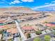 Wide aerial view showcases a picturesque neighborhood with stunning mountain views in the background at 11275 Gammila Dr, Las Vegas, NV 89141