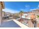 Backyard view from patio features decorative lion statues, palm trees, desert landscape, and mountain views at 11275 Gammila Dr, Las Vegas, NV 89141