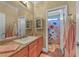 Charming bathroom features a decorative shower curtain, vanity with ample storage, and tile flooring at 11275 Gammila Dr, Las Vegas, NV 89141