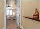 Comfortable bedroom featuring a ceiling fan, neutral tones, and backyard access at 11275 Gammila Dr, Las Vegas, NV 89141