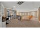 Spacious hallway with decorative ironwork and staircase, offering ample natural light and access to other rooms at 11275 Gammila Dr, Las Vegas, NV 89141