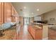 Open concept kitchen includes granite countertops, stainless appliances, and a breakfast bar at 11275 Gammila Dr, Las Vegas, NV 89141